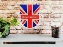 Load image into Gallery viewer, Flag Clock, Shield Shape Featuring The Union Jack Flag of Great Britain, With GREAT BRITAIN across the Middle, 2 Sizes Available, Battery Included