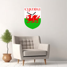 Load image into Gallery viewer, Flag Clock, Shield Shape Featuring The Flag of Wales, With CYMRU across the Top, 2 Sizes Available, Battery Included