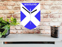 Load image into Gallery viewer, Flag Clock, Shield Shape Featuring The Flag of Scotland, With SCOTLAND across the Top, 2 Sizes Available, Battery Included
